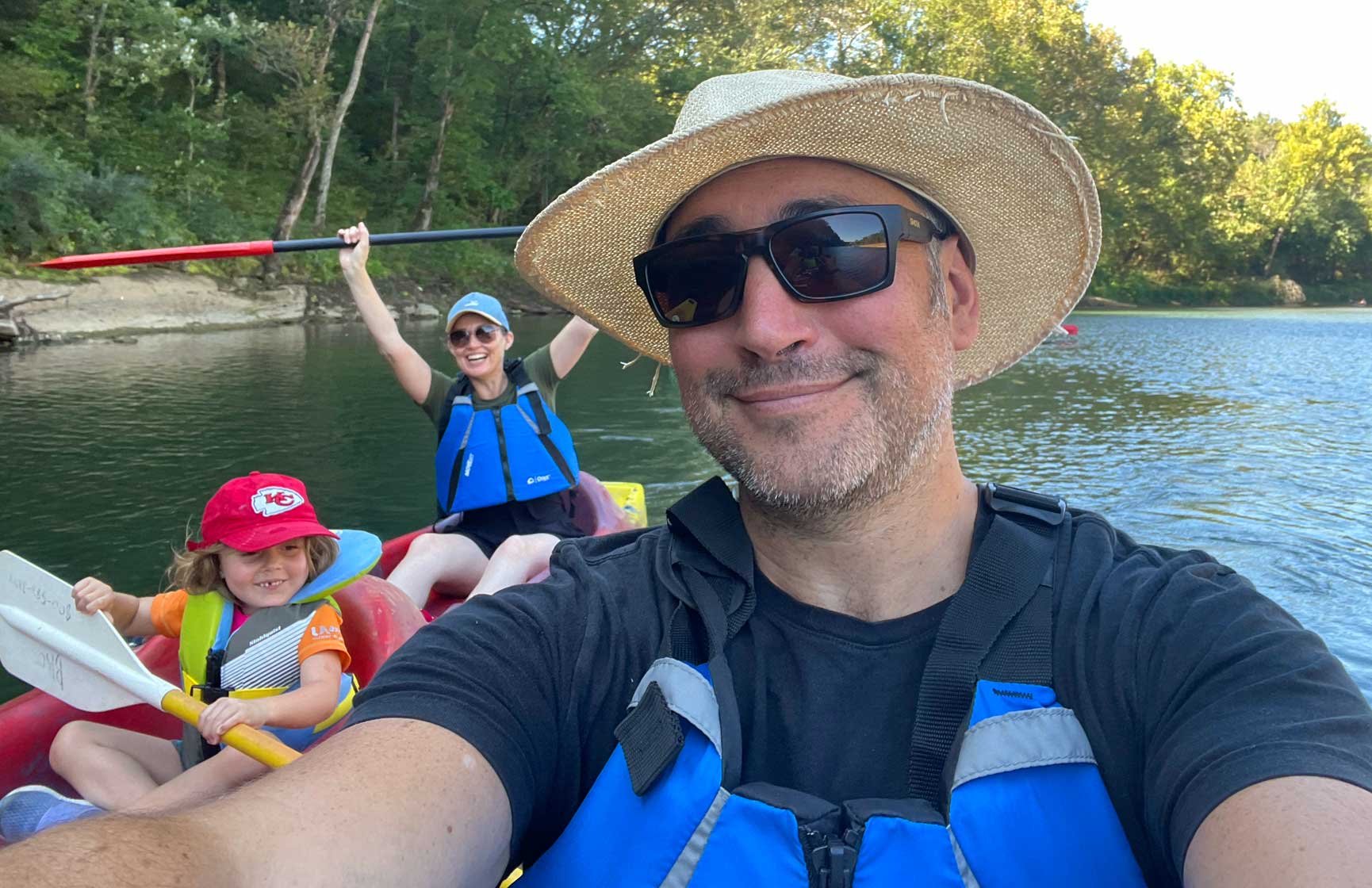 Slalom General Manager Daniel Cross and family selfie of them boating together.