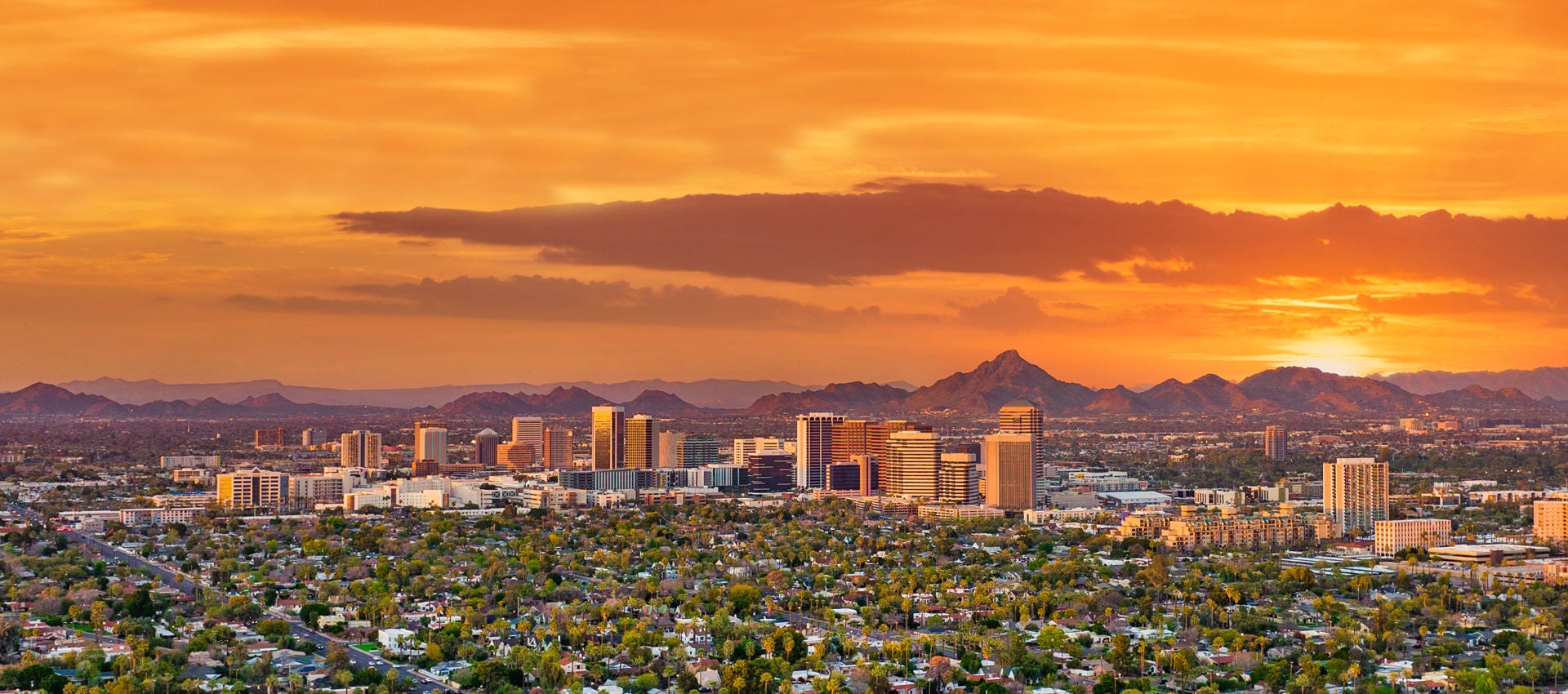 Colorful rays of sunshine fade away on Phoenix, Arizona. 