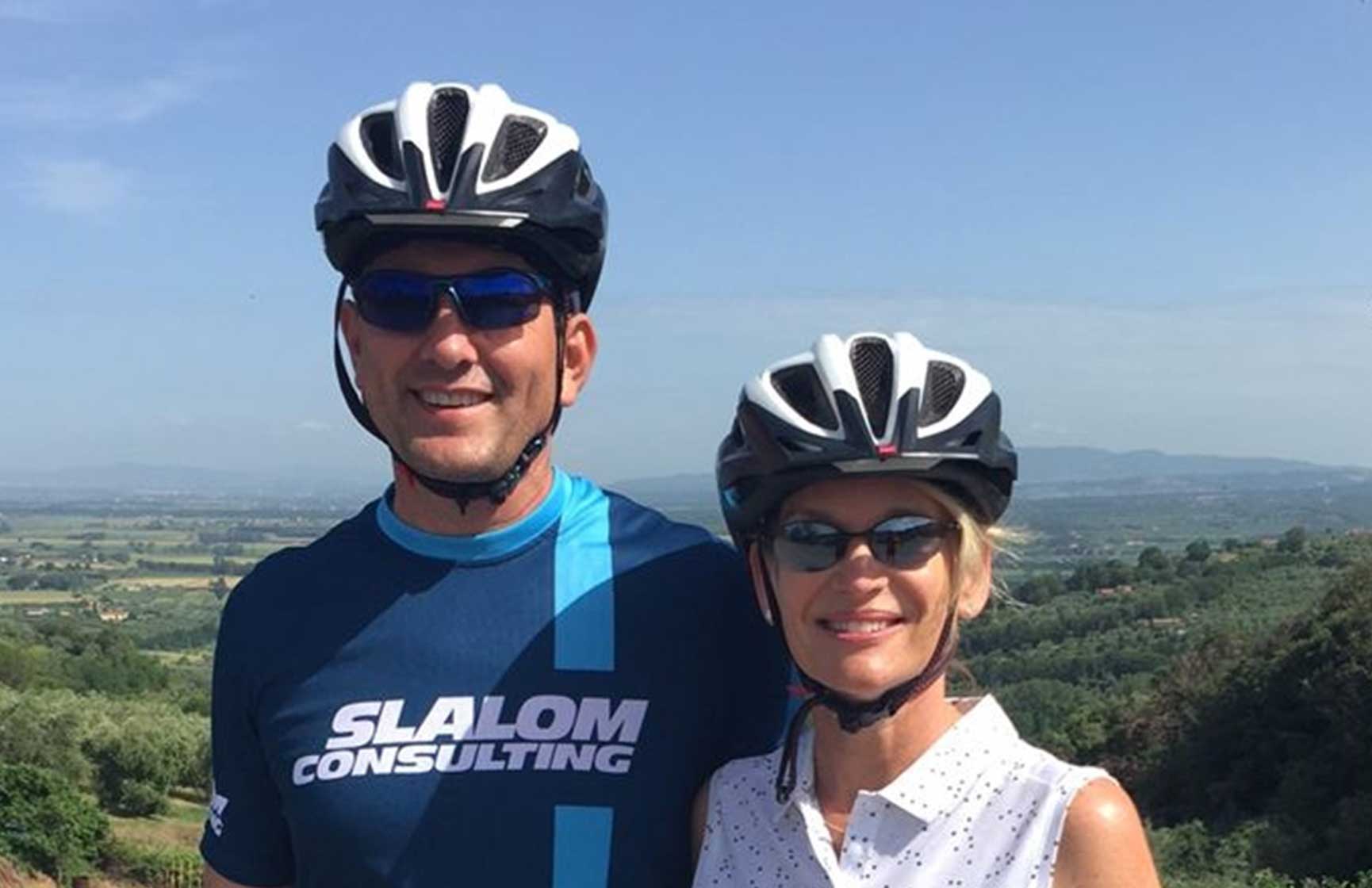 Slalom General Manager Darrin Ahrens and woman pose in biking gear.