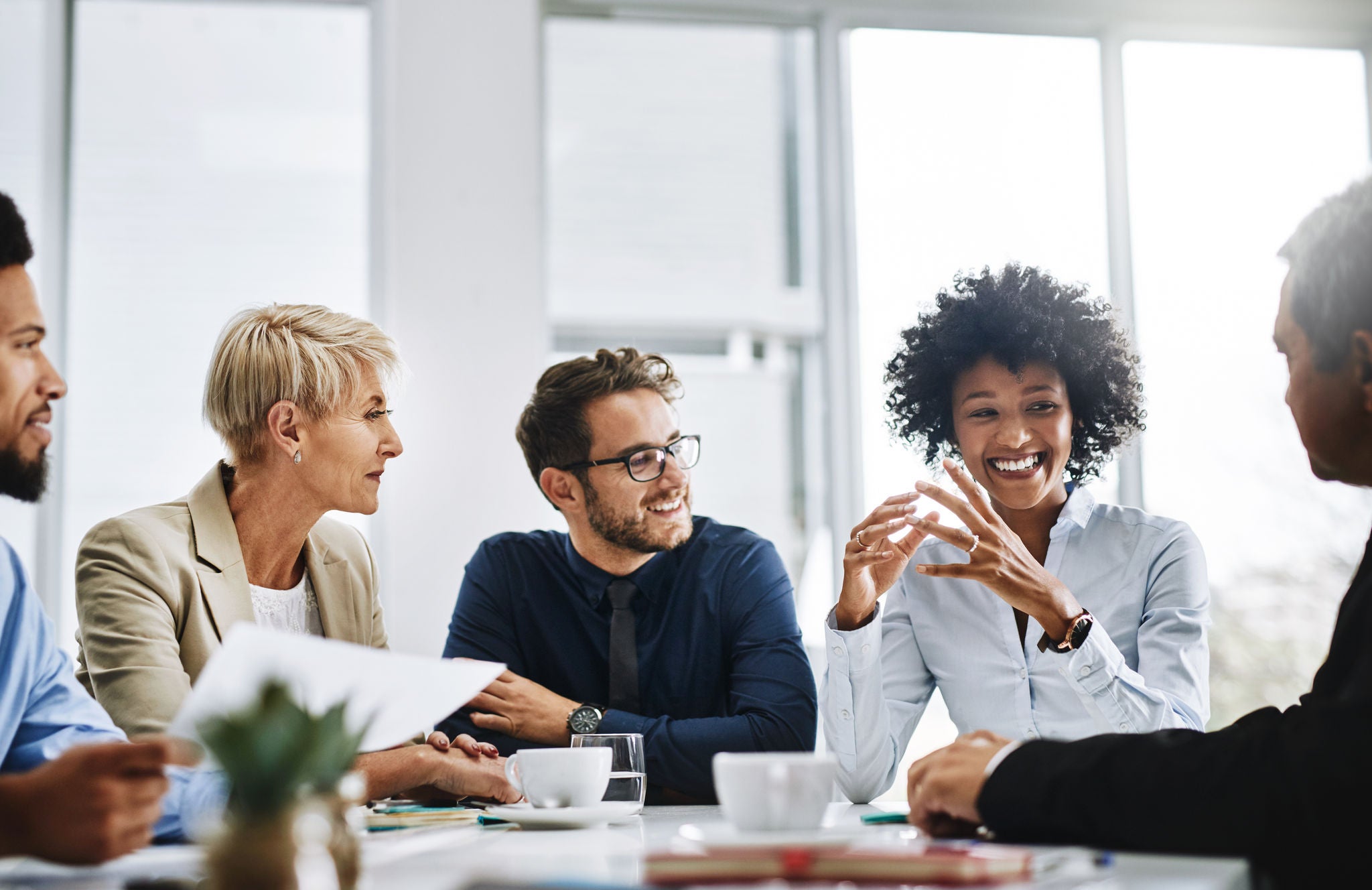 Shot of a group of businesspeople sitting together in a meeting