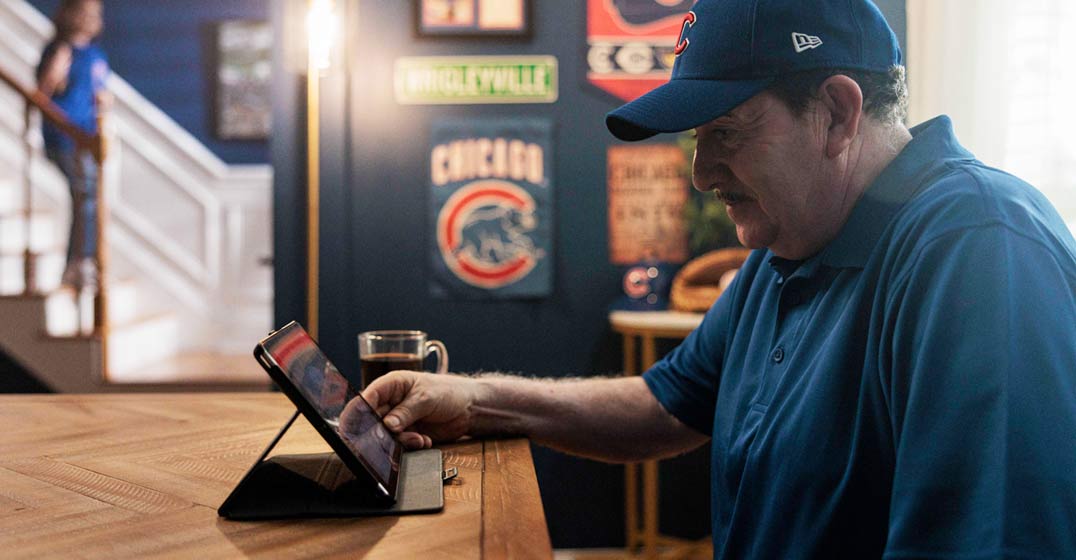 Grandfather engaging Chicago Cubs content through a digital experience.