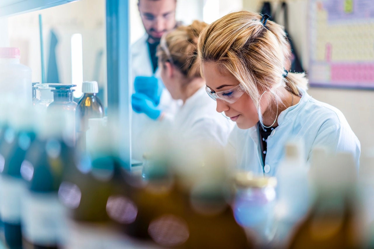 A female scientist in laboratory working.