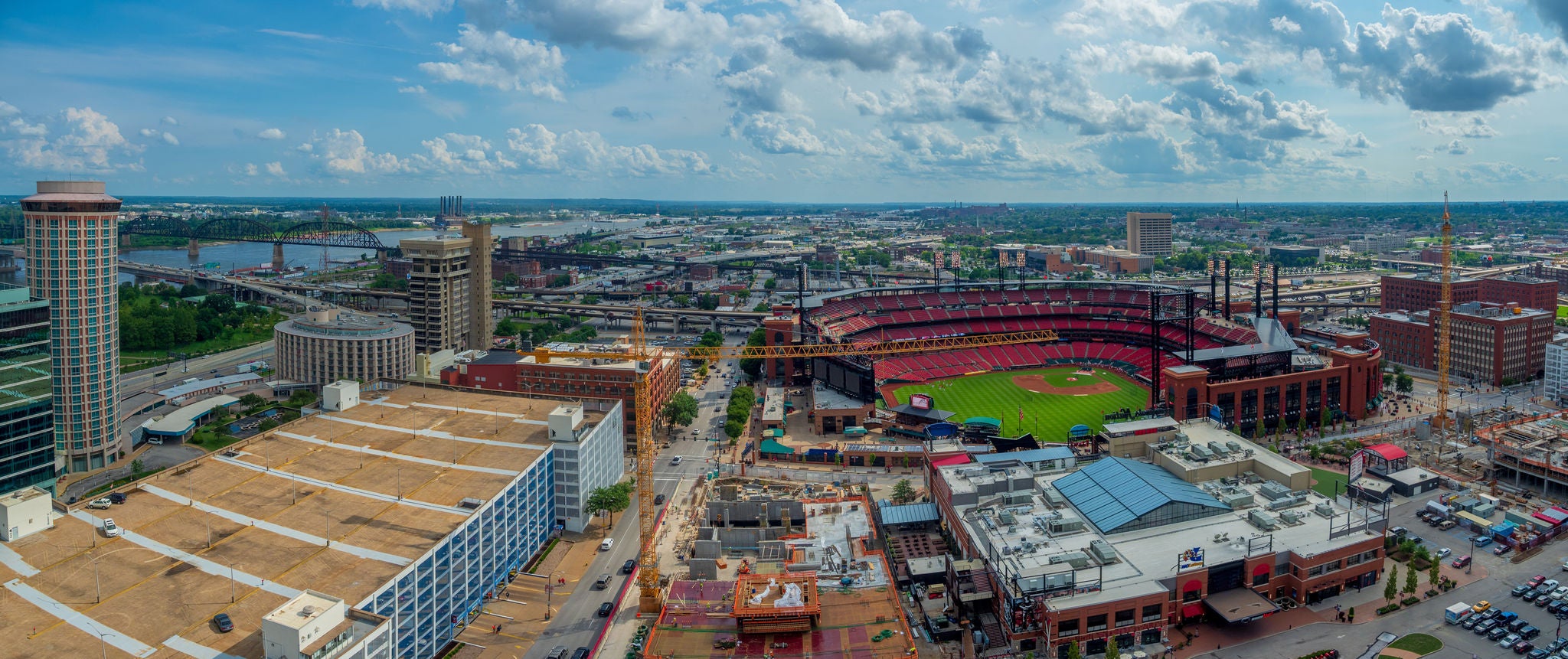 A panorama of the St. Louis neighborhood around Busch Stadium on a summer day.