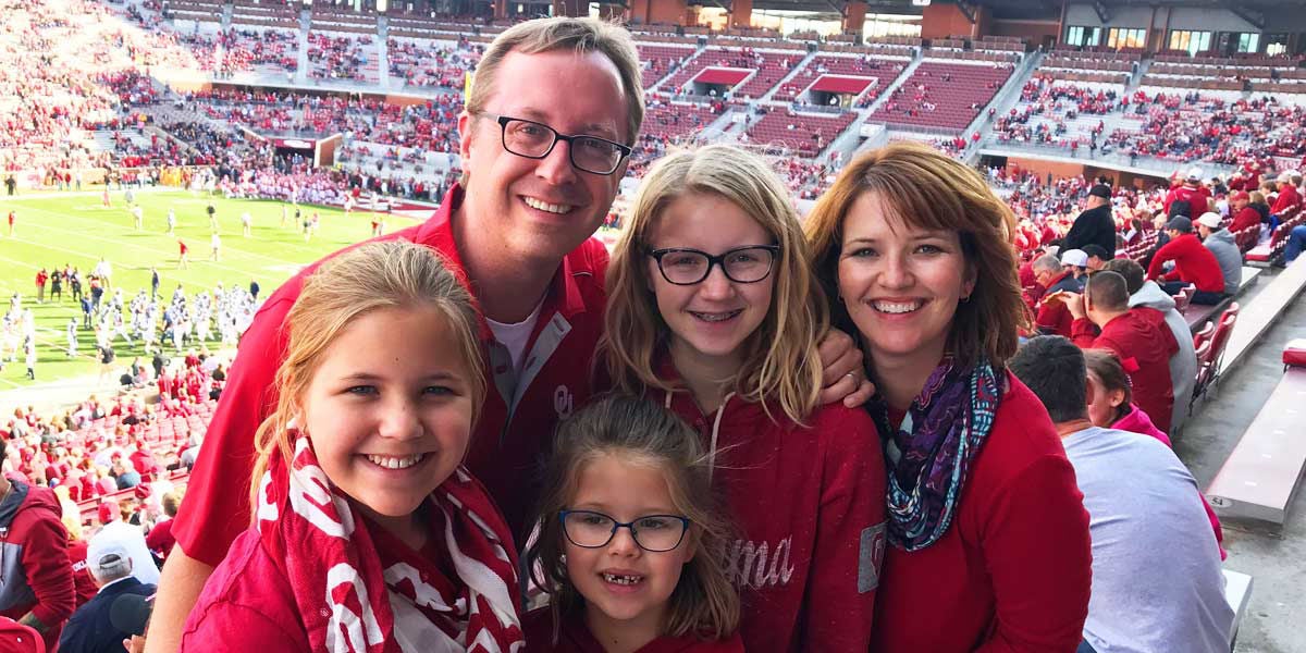 Slalom General Manager Lindsay Wenk and family in stadium at game.