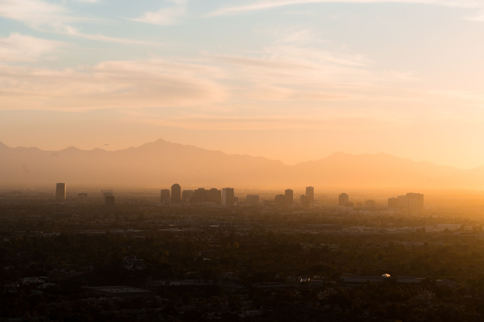 Colorful rays of sunshine fade away on Phoenix, Arizona. 