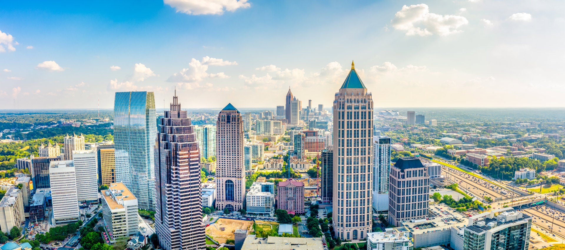 The Atlanta skyline stands tall on a sunny day.