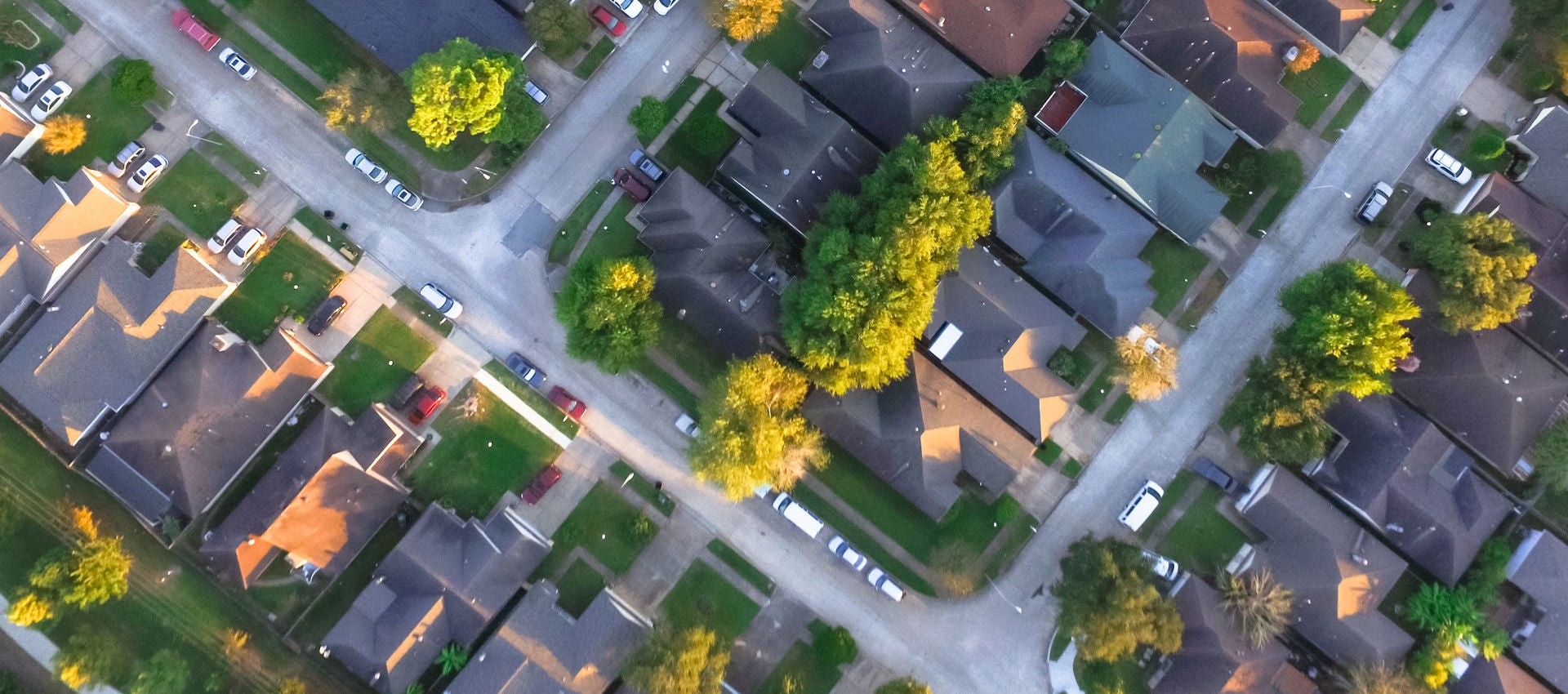 An aerial view of an American neighborhood at sunset.