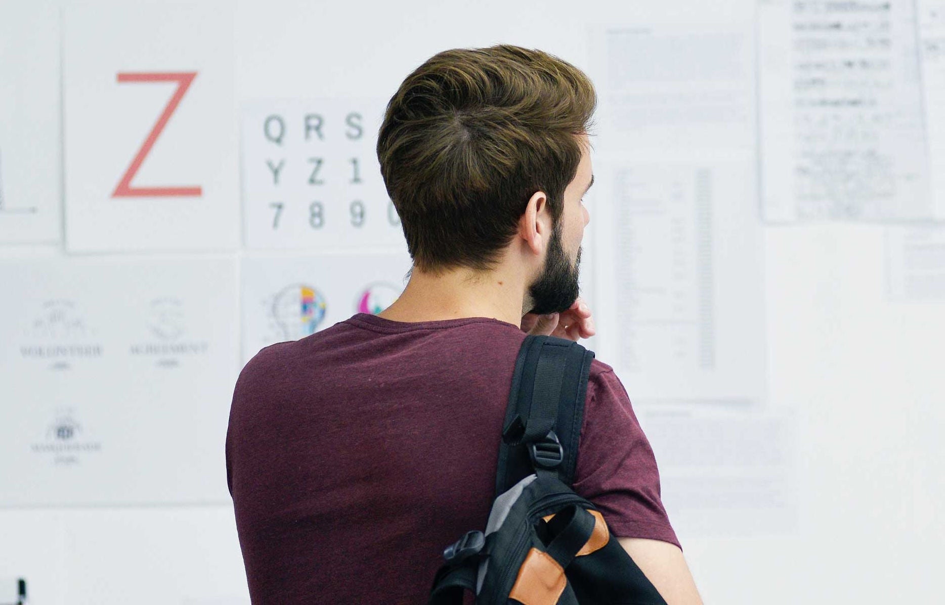employee looking at dry erase board