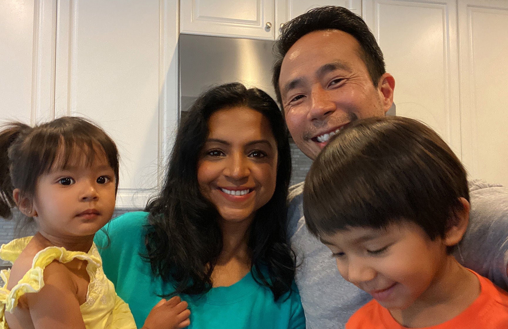 Slalom General Manager Pritha Sridharan and family huddled together at home.
