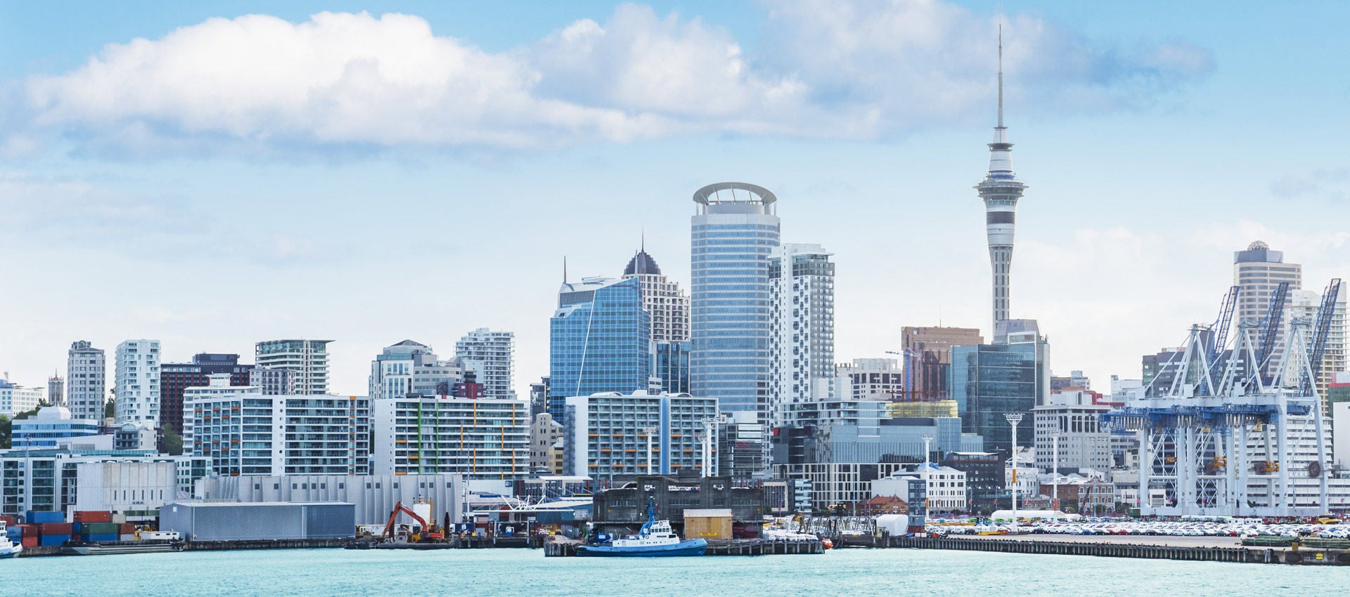 The Auckland skyline as seen on a pleasant day from the harbor. 