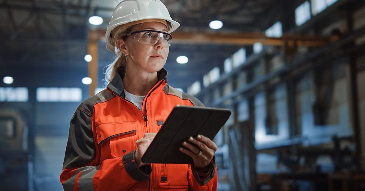 Woman worker inspecting the building. 