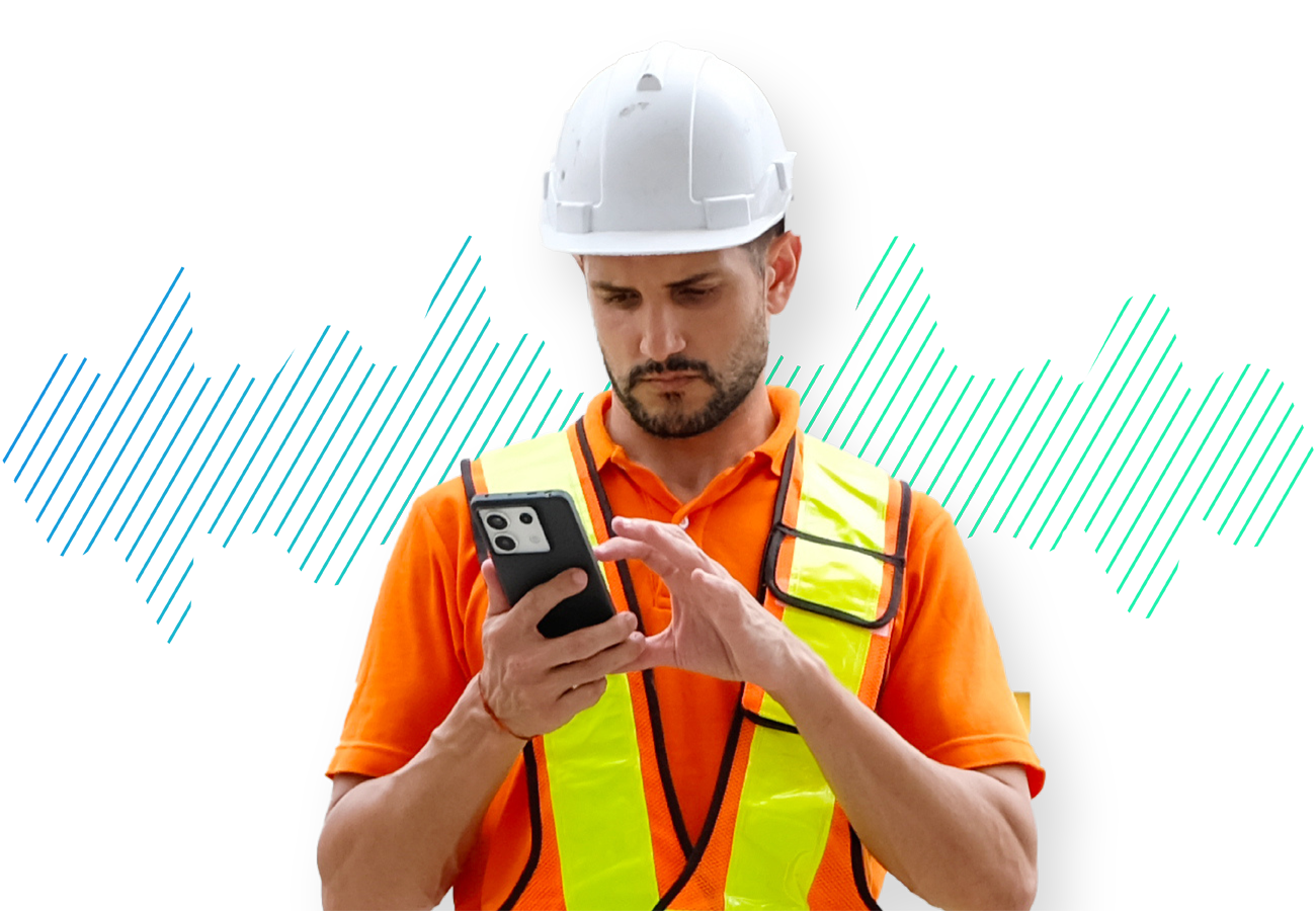construction worker in vest on phone