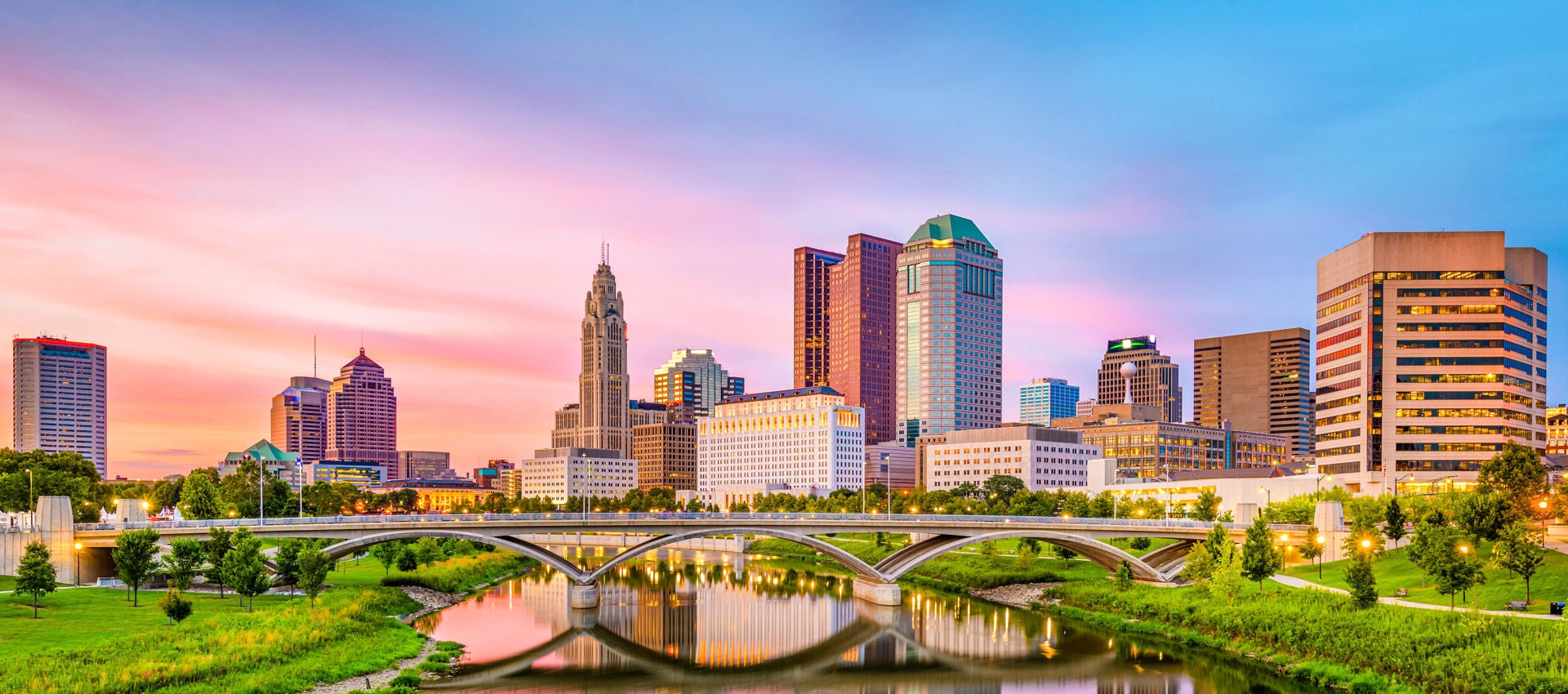 Sunset photo of the Columbus skyline on a summer evening.