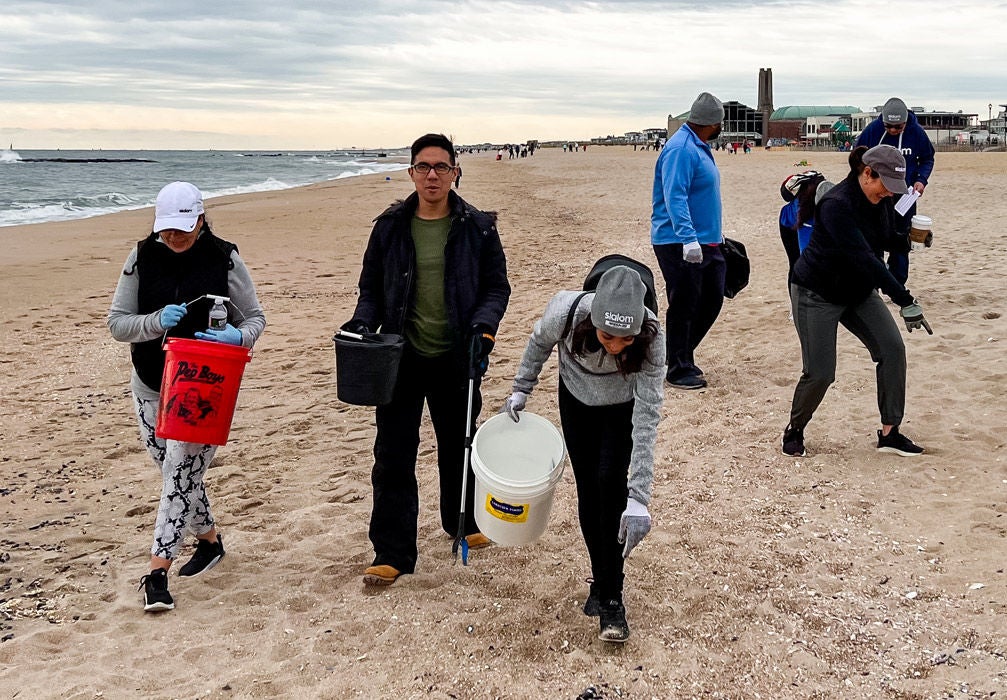 Slalom team cleaning up the beach.