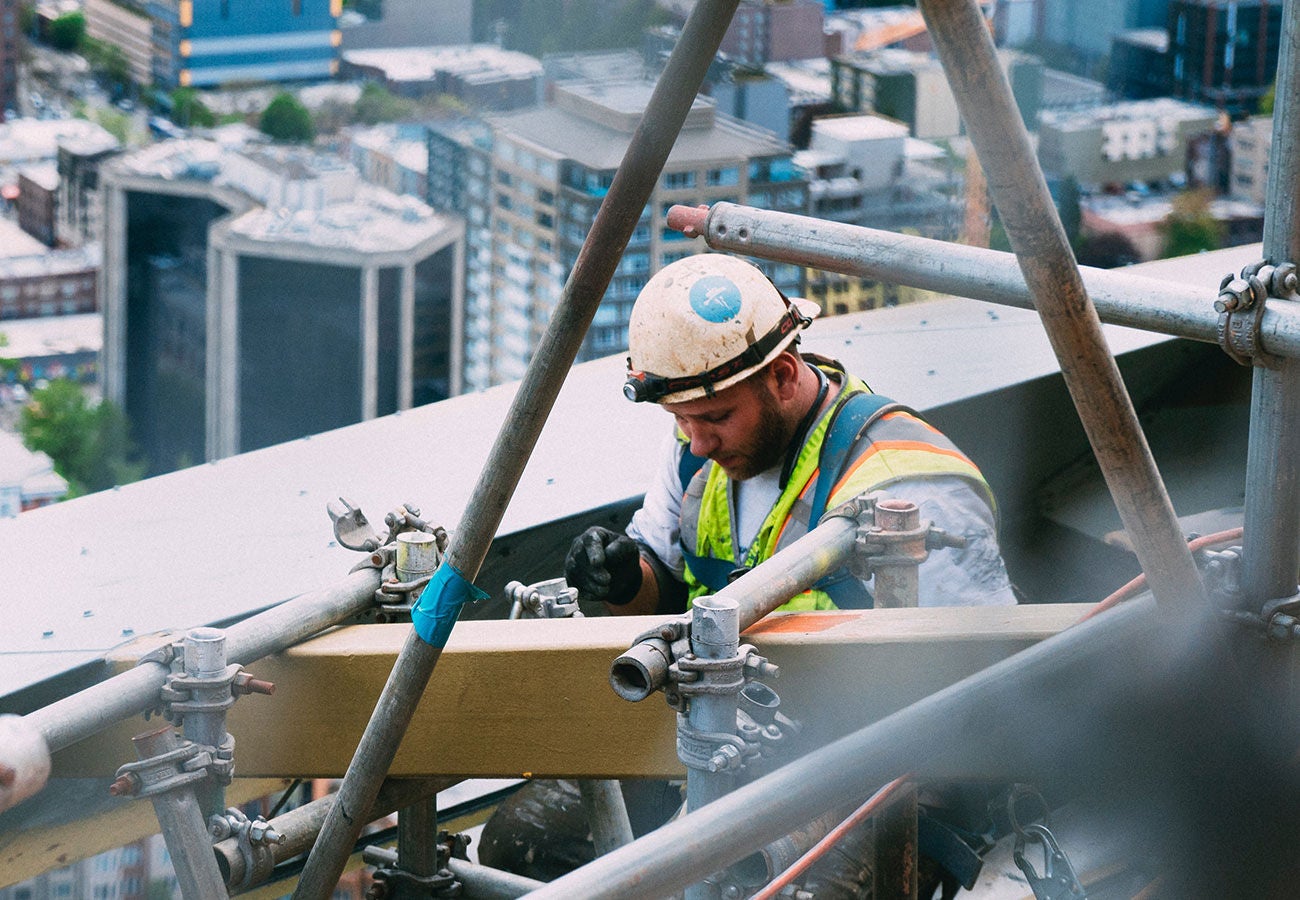 Construction worker working on skyscraper.