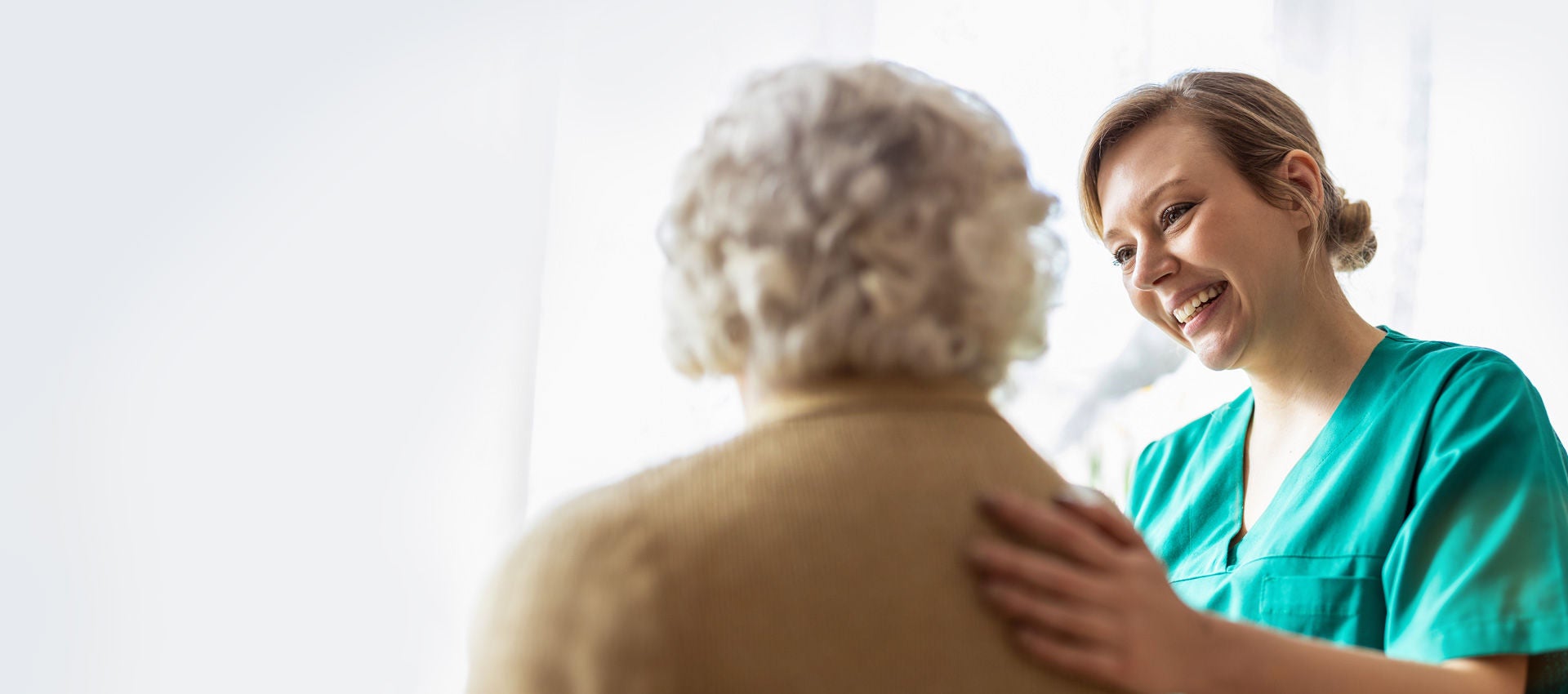 A medical professional works with a patient.