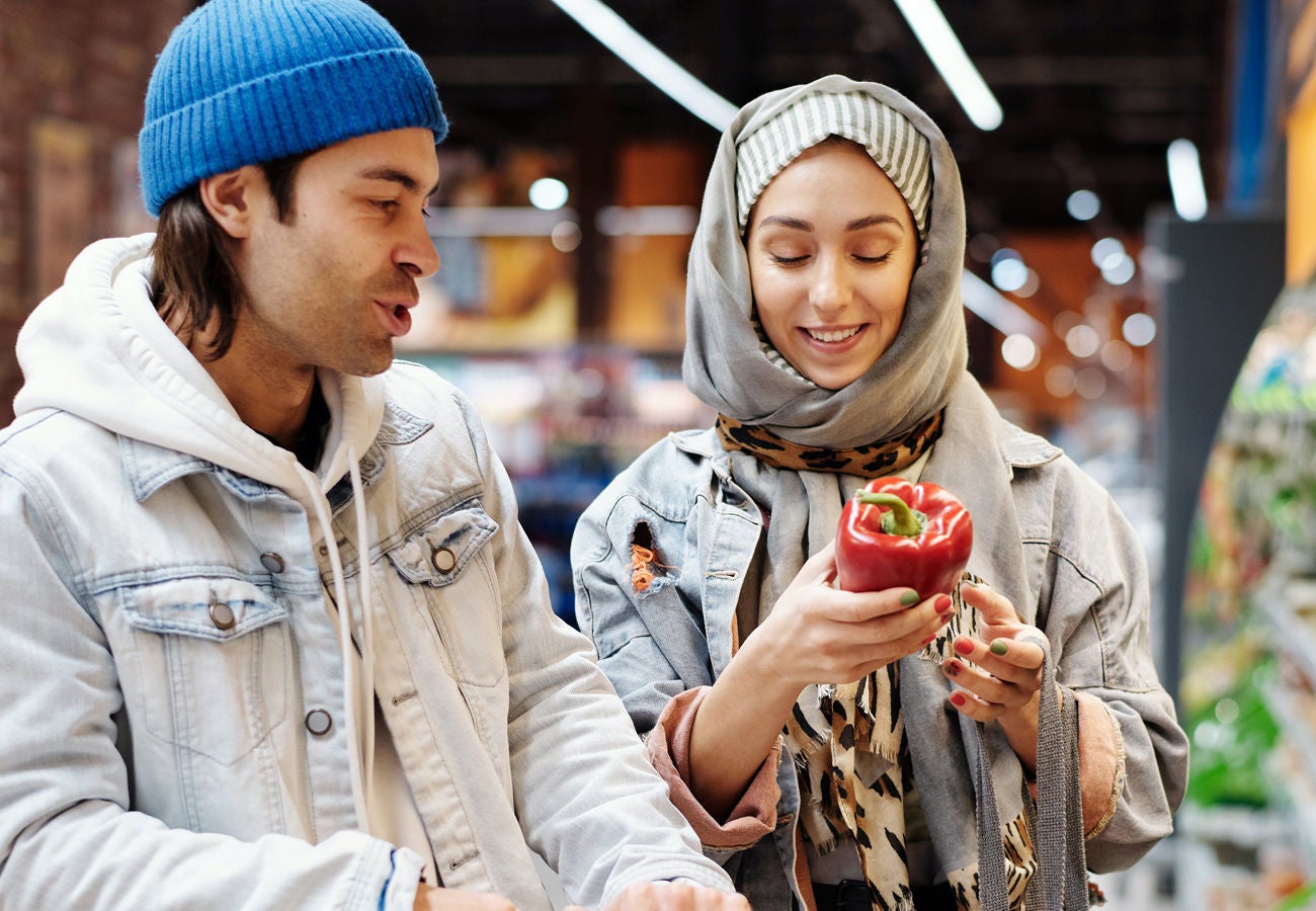 Two customers shop for groceries.