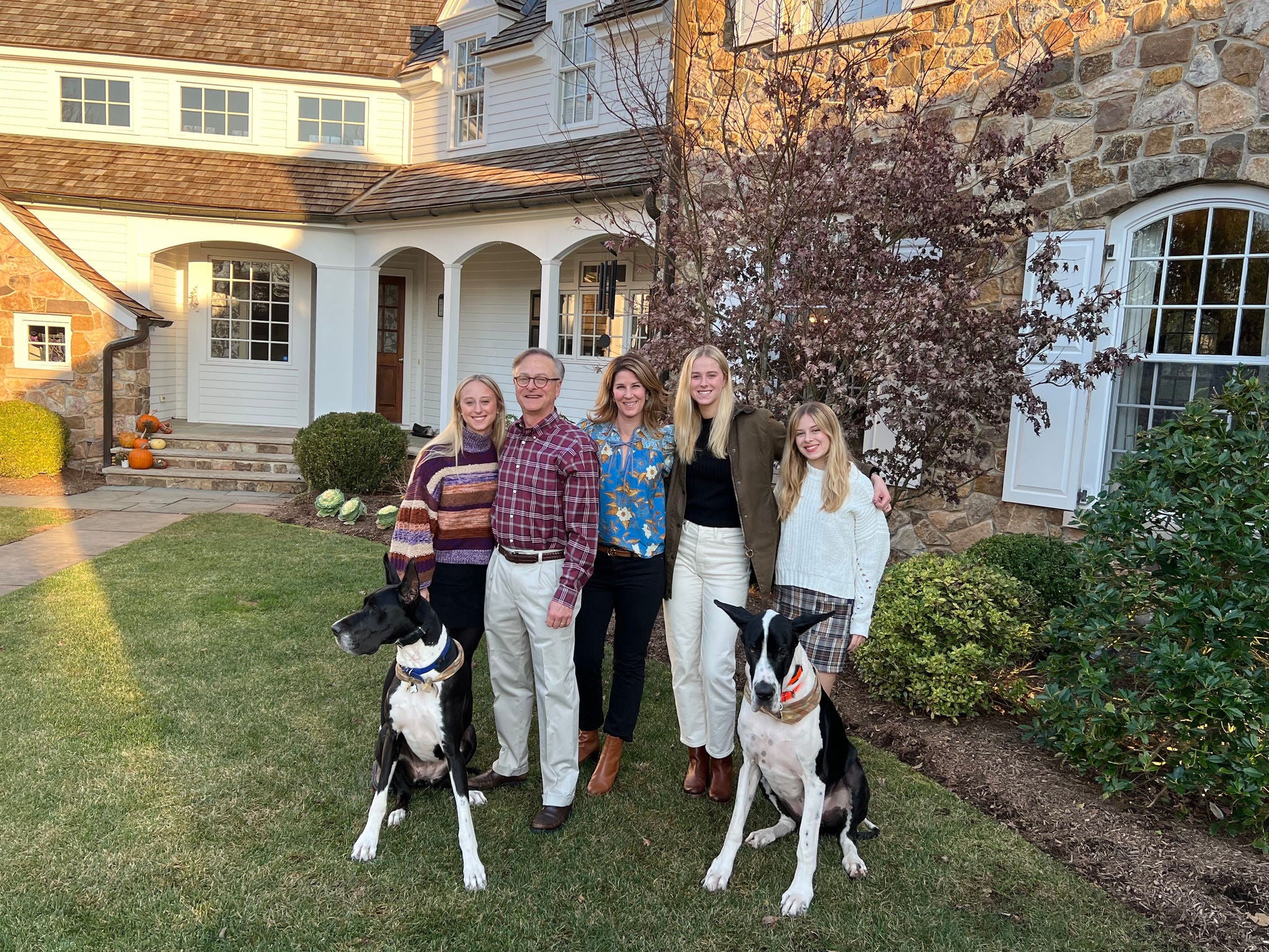Jeff Van Wie and his family in front of a house