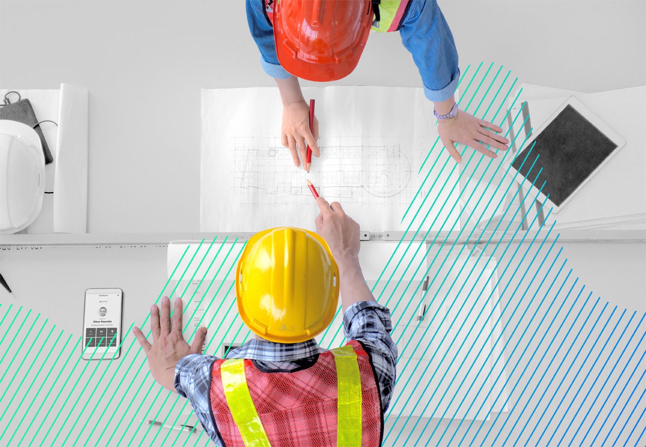 construction employees in hardhats going over plans placeholder