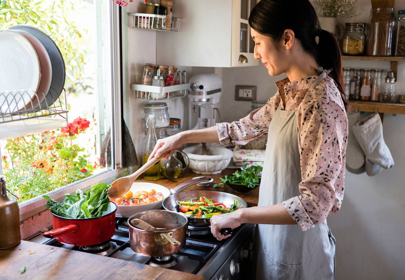 Woman cooking in her kitchen at home.