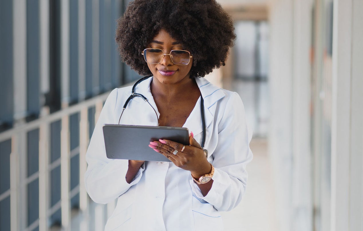 Female doctor working with a tablet.