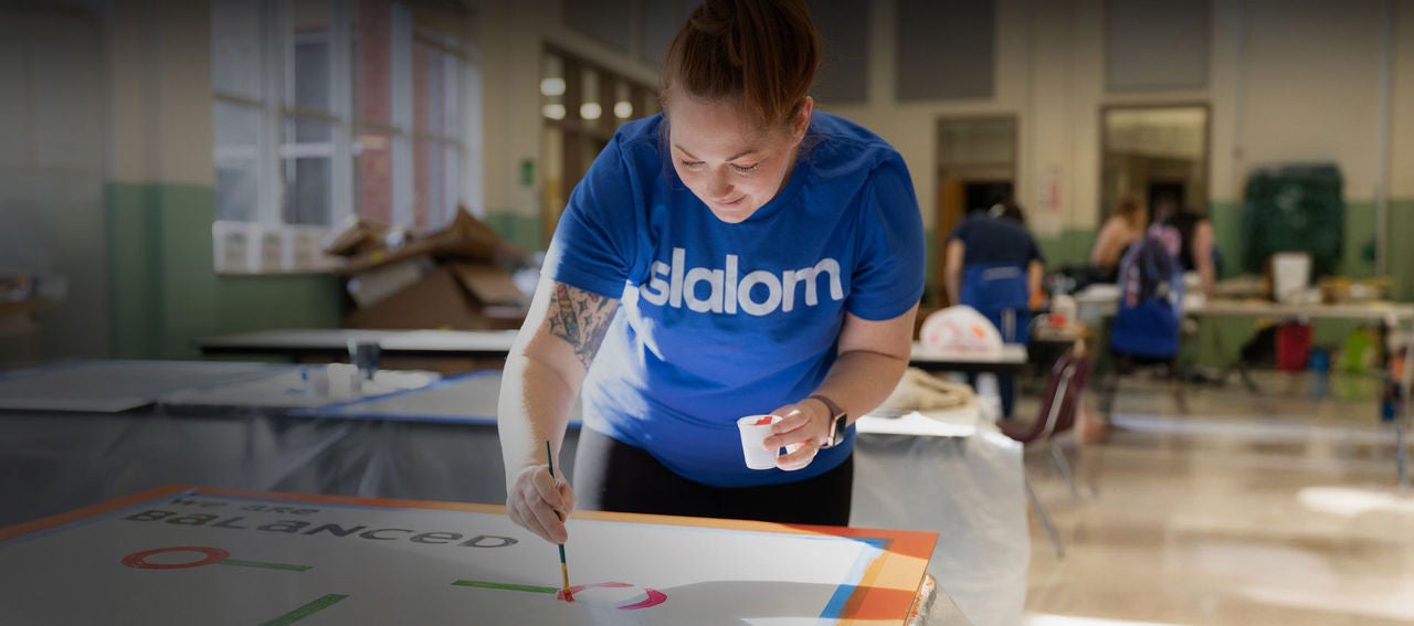 A Slalom employee paints new decorations for a local elementary school for MLK Day of Service in Atlanta.