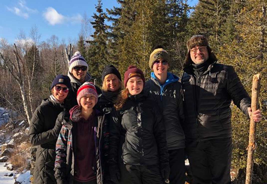 Slalom General Manager Darrin Ahrens and a group of people pose on a hike.
