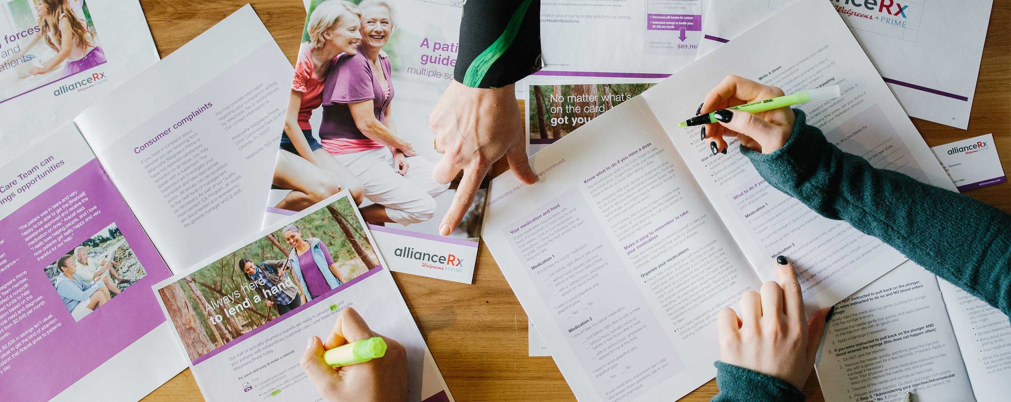 A variety of company literature on a table.