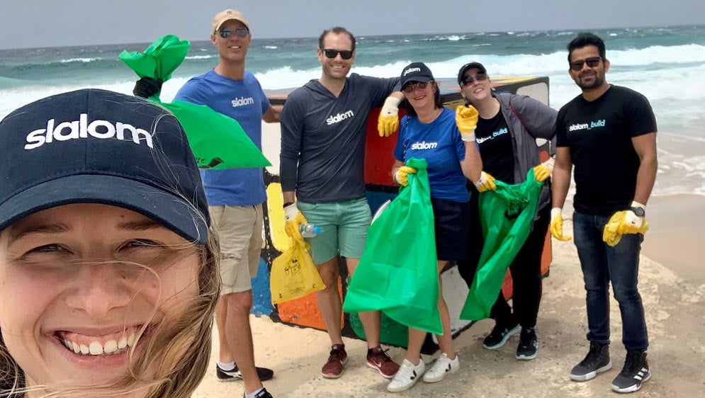 The Slalom team donates to help clean up the beach.