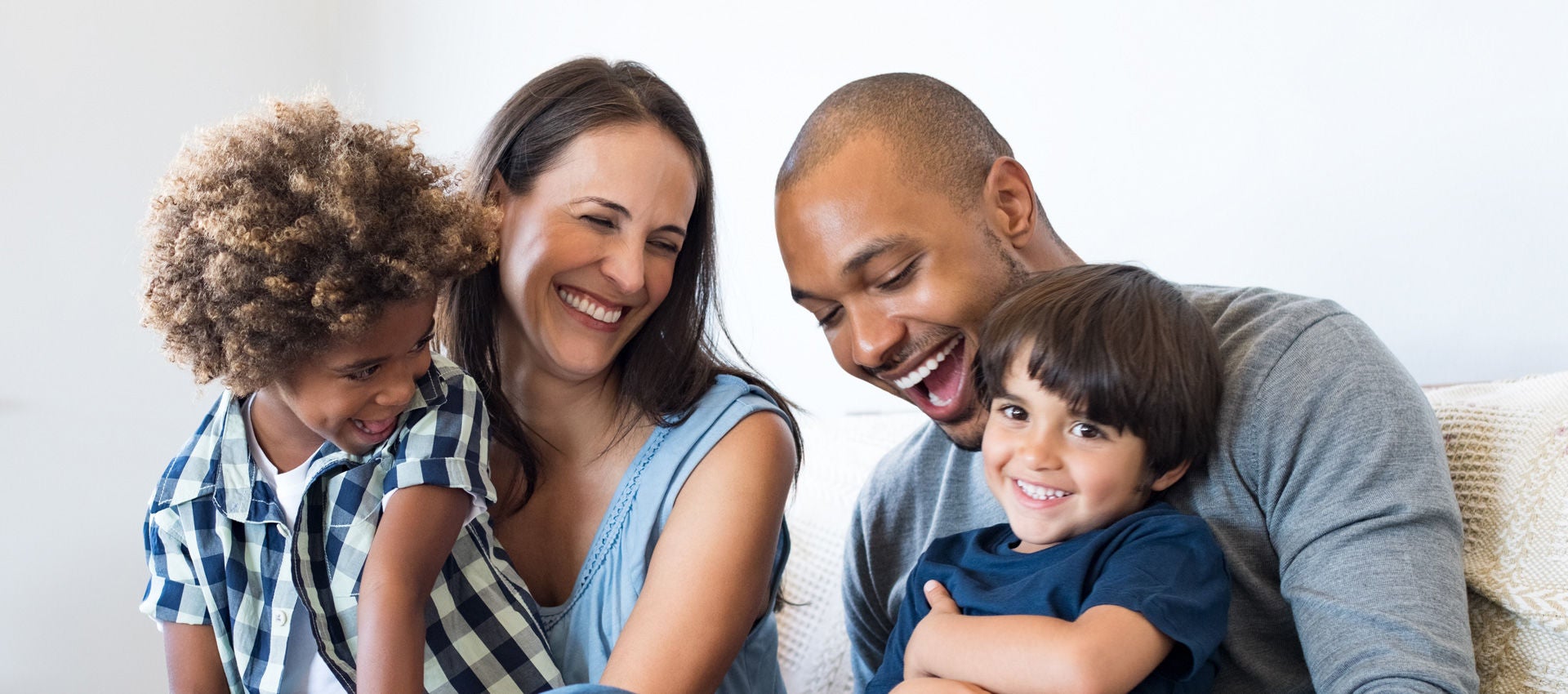 story uscis multiethnic family laughing header 1920x850 placeholder