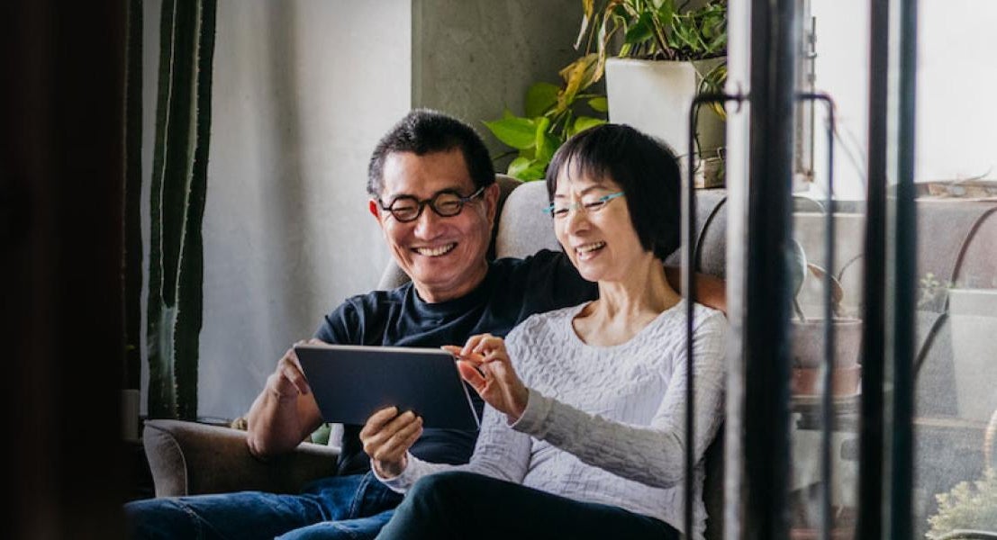 A couple looking at an ipad together
