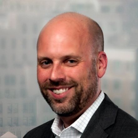 Derek Huffman's professional headshot.